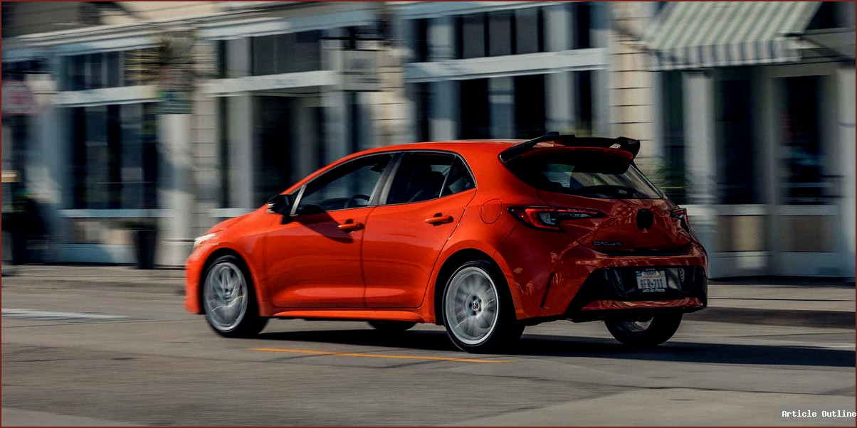2026 Toyota Corolla FX in Inferno orange with black spoiler and white wheels